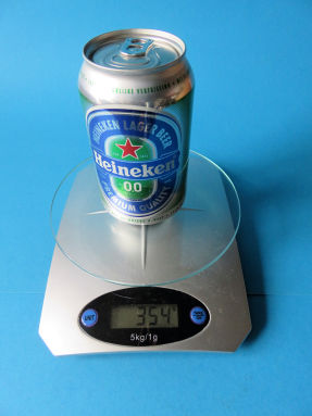 weighing the full can of beer