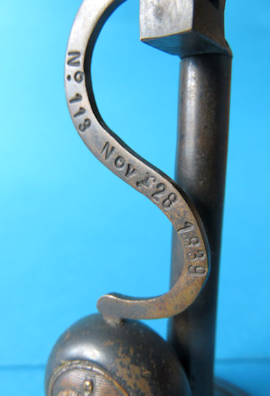 curved counterweight arm has the Registered Design Number 113